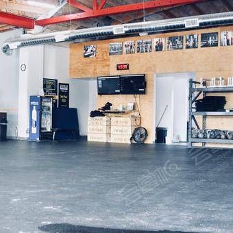 Industrial open gym space with floor to ceiling windows